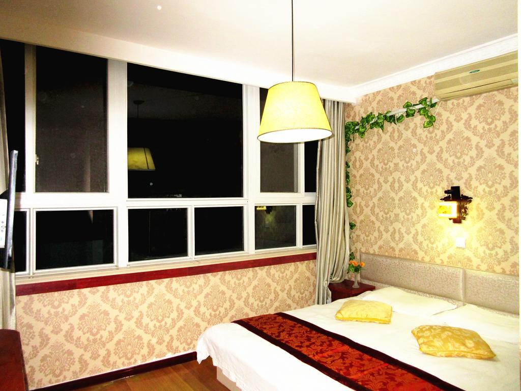 25°C Four Season Youth Hostel Qingdao Zimmer foto