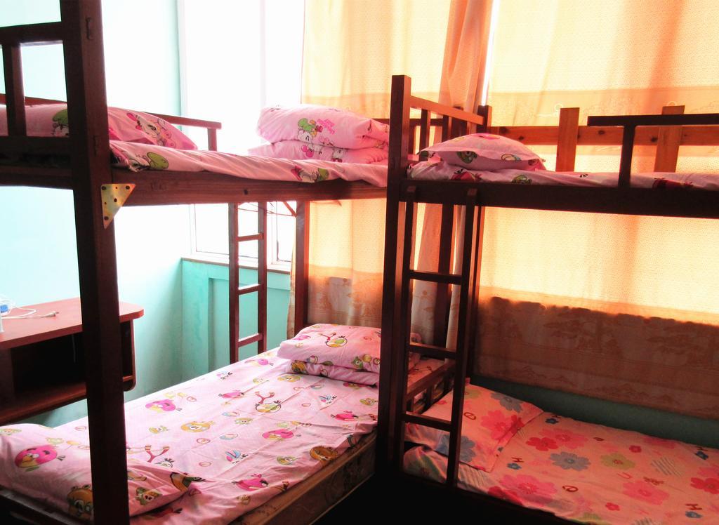 25°C Four Season Youth Hostel Qingdao Zimmer foto